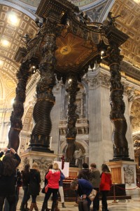 Students listen to our Italian guide, Irene, as she discusses Bernini's Baldacchino in St. Peter's Basilica